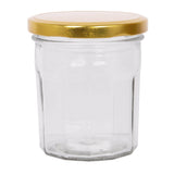 Clear glass jar with a gold lid on a white background