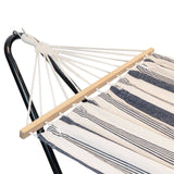 Striped hammock with wooden slats on a metal stand against a white background