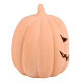 A decorative terracotta orange pumpkin-shaped decoration with a ribbed texture and carved triangular eye and mouth cutouts, shown on a plain white background.