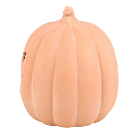 A decorative terracotta orange pumpkin-shaped decoration 