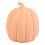 A decorative terracotta orange pumpkin-shaped decoration 