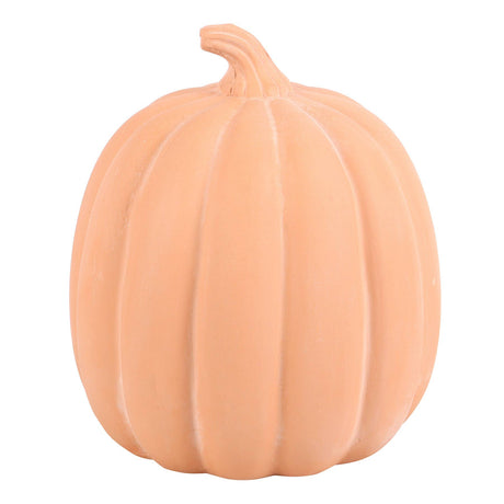 A decorative terracotta orange pumpkin-shaped decoration 
