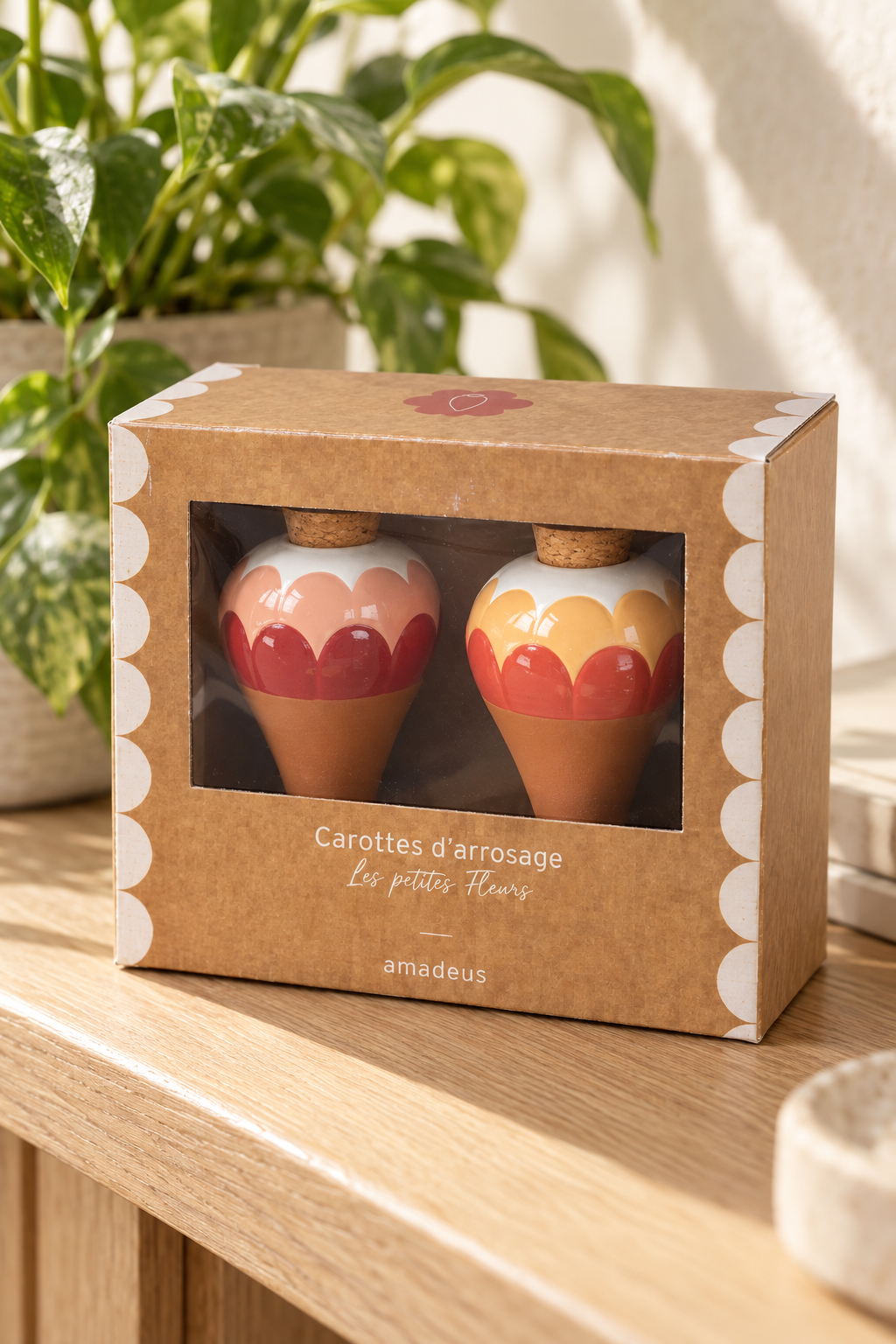 Bring blush pink, coral red and ochre into your houseplant collection. These Ana Rose terracotta watering spikes combine scalloped ceramic tops with a practical slow-release watering function