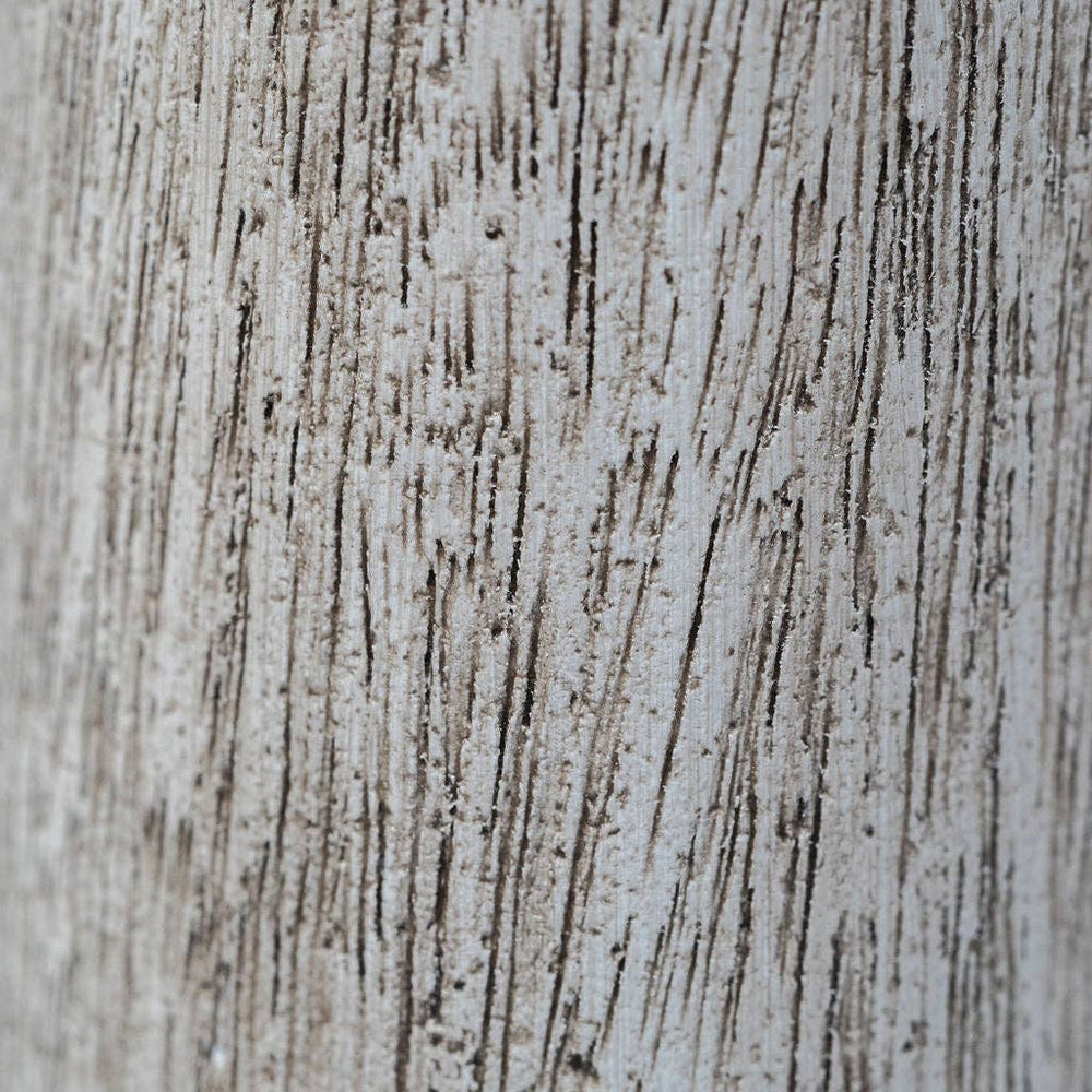 Close-up of a textured surface with horizontal lines and speckles