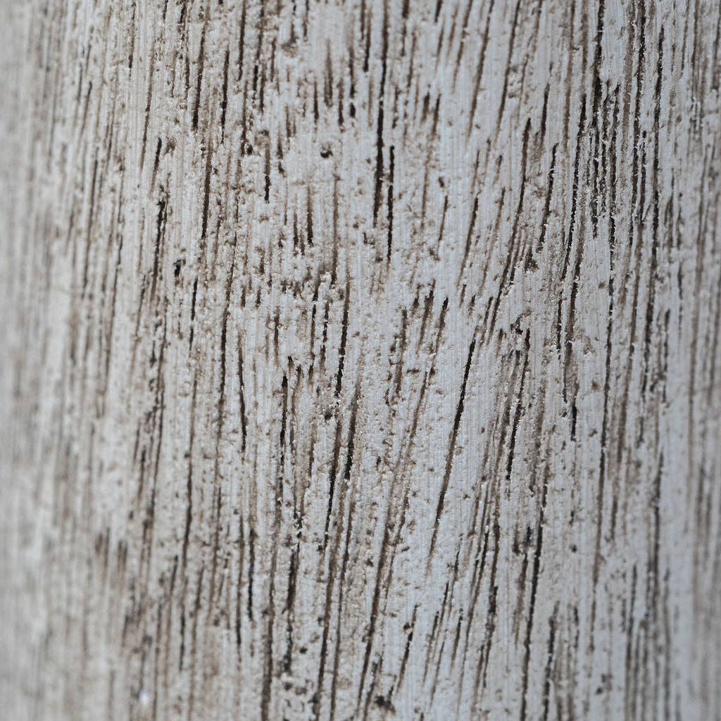Close-up of a textured surface with horizontal lines and speckles