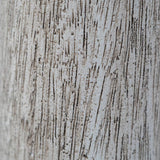 Close-up of a textured surface with horizontal lines and speckles