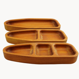 Set of three wooden trays with compartments on a white background
