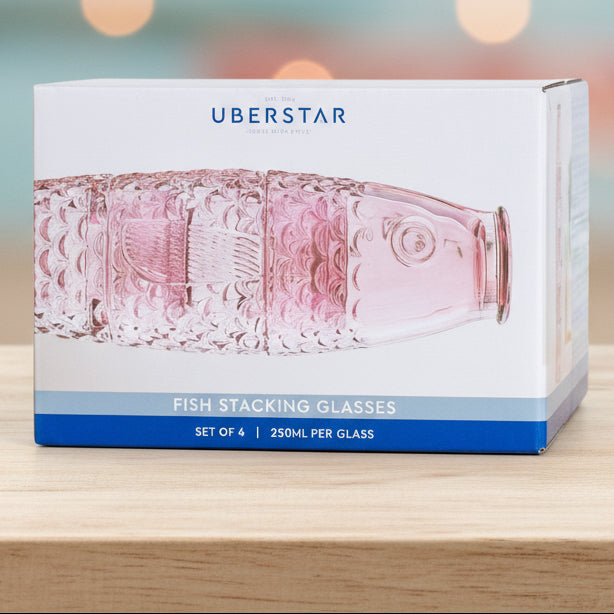 Box of Uberstar pink stacking glasses on a white background