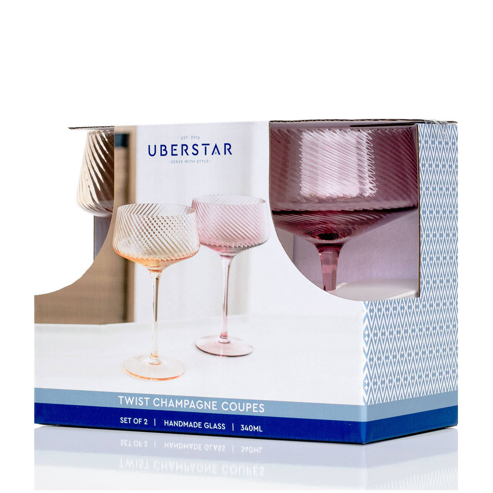 Box of Uberstar twist champagne coupes with two glasses on a white background