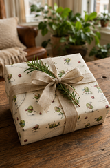 Scarf-wearing Brussels sprouts skate, race and tumble across the ice in this funny illustrated Christmas wrapping paper, with cranberries, skating poles and looping skate marks on warm ivory.
