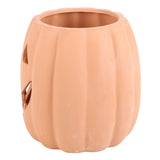 Ceramic pumpkin with jack-o'-lantern face on a white background