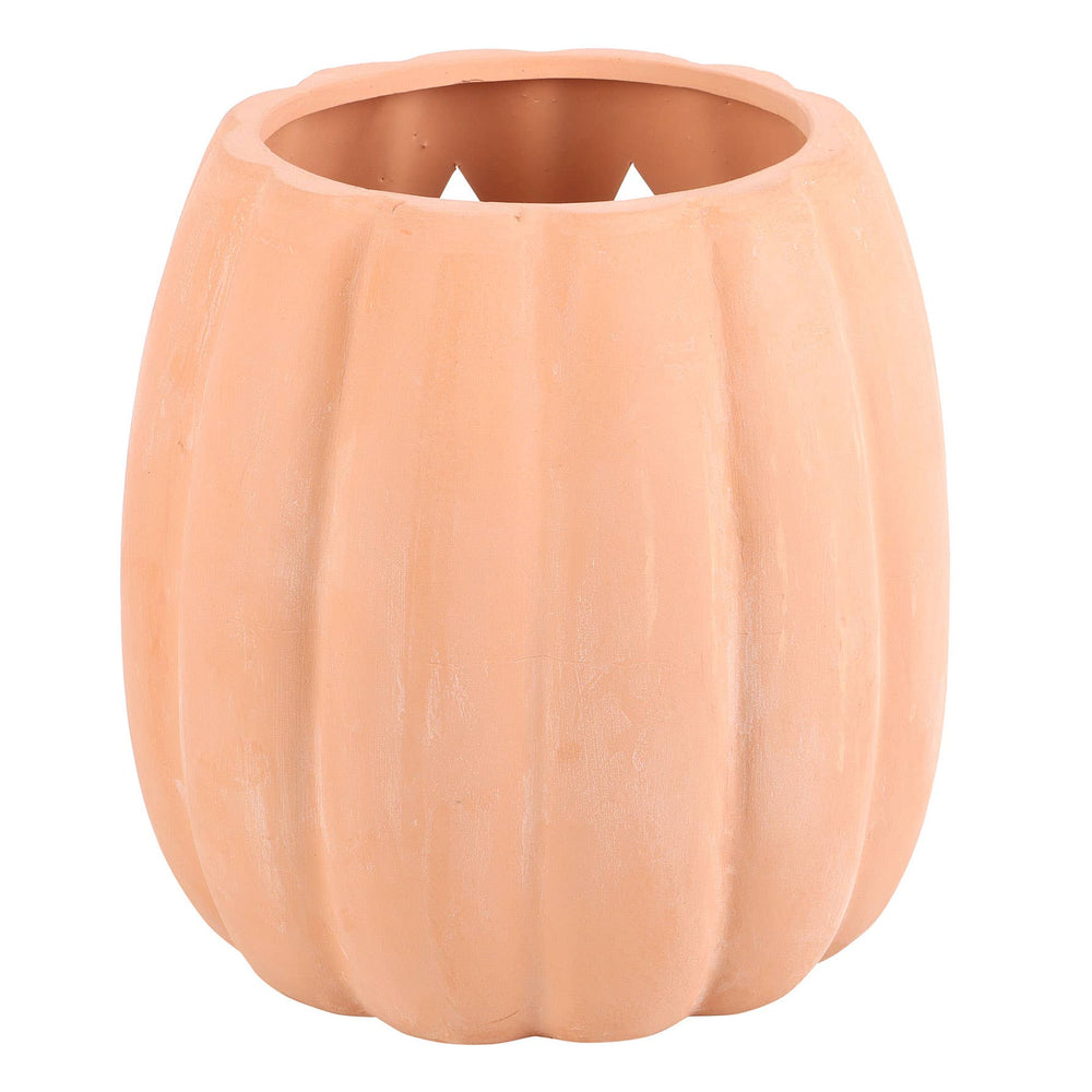 Ceramic pumpkin with jack-o'-lantern face on a white background