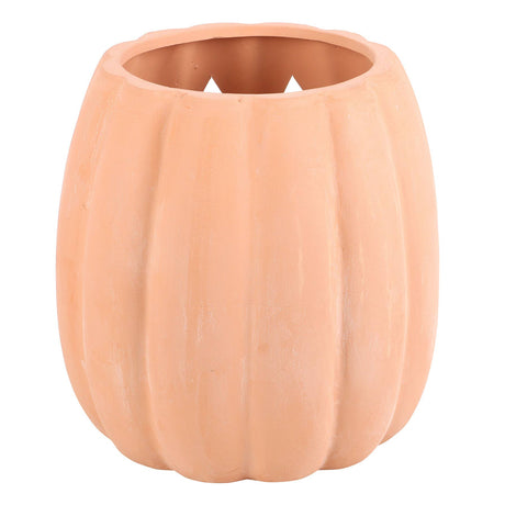 Ceramic pumpkin with jack-o'-lantern face on a white background