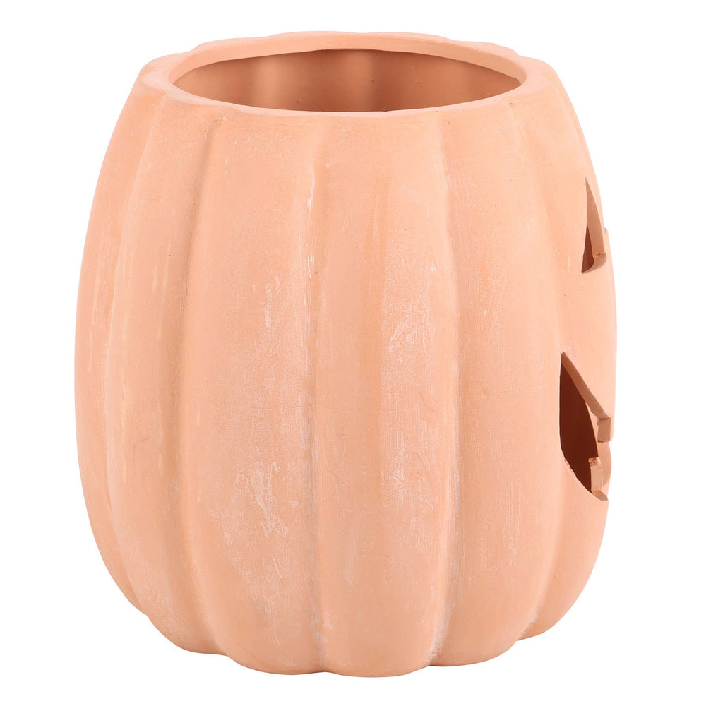 Ceramic pumpkin with jack-o'-lantern face white background