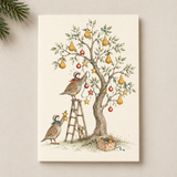 A vertical art print featuring a vintage-style illustration of two quail birds decorating a pear tree with red ornaments and stars, shown against a warm beige background with a pine branch in the top-left corner.