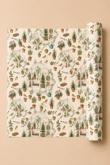 A roll of Christmas wrapping paper with a detailed garden and greenhouse pattern, partially unrolled to show the repeating design on a solid beige background.
