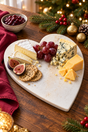 Heart-shaped cheese board made from natural white marble, for presenting cheese and accompaniments. Measures 23cm wide × 27cm long × 1.5cm thick.