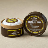 Dalit handmade soap curcuma in a brown container on a beige background