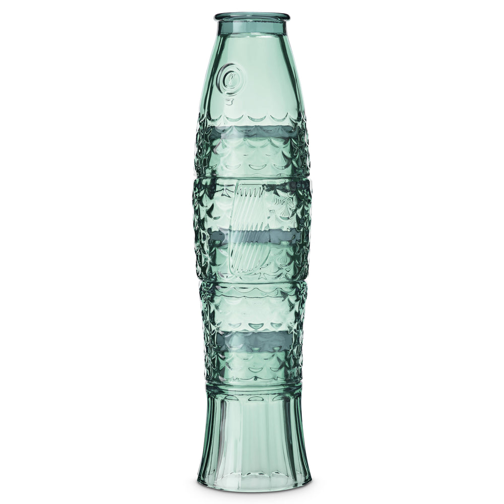 Decorative green glass tumblers with intricate fish patterns on a white background