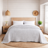 scandi bedroom with dove grey bed throw