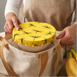Yellow covers with black patterns on bowls in various settings