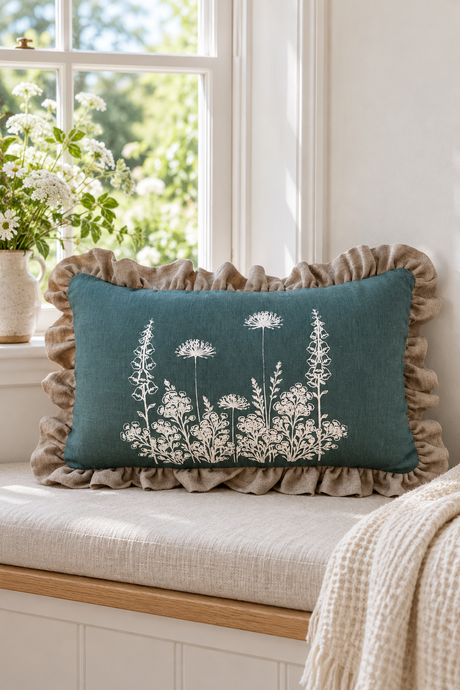 Duck egg Florilegium rectangular cushion with a large natural ruffle on an oatmeal window seat.