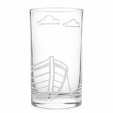 Clear glass with engraved boat design on a white background