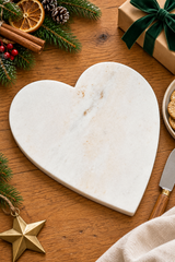 Heart-shaped cheese board made from natural white marble, for presenting cheese and accompaniments. Measures 23cm wide × 27cm long × 1.5cm thick.