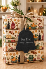 Blank bell-shaped slate gift tag in natural charcoal grey with a rustic rope loop for attaching to Christmas presents.
