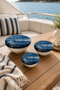 Set of 3 reusable Fjære Coastal linen bowl covers, hand printed in Derbyshire with a coastal design inspired by shoreline huts and beached boats. 