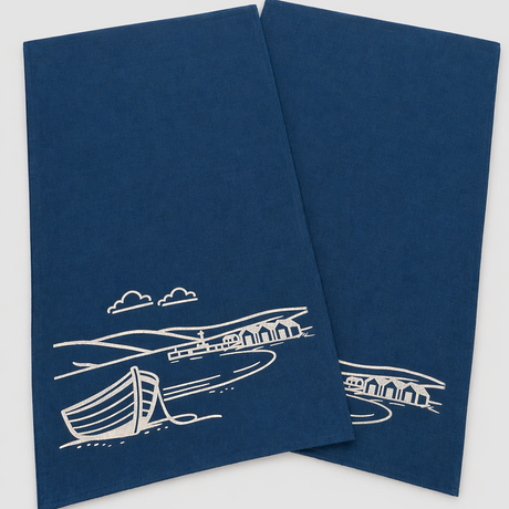 Set of 2 navy linen tea towels with white Fjære coastal design. Hand printed in Derbyshire. Absorbent, quick drying and made for everyday use.