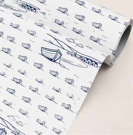 Roll of paper with blue boat pattern on a white background