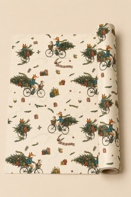 Illustrated fox Christmas wrapping paper featuring a scarf-wearing fox cycling through the snow with a little dog in the front basket and a decorated fir tree and presents across the rear. The pencil-sketch design includes tartan scarves, bells, pine sprigs, baubles, parcels and tyre tracks in teal, green, mustard, red and pink on warm ivory.