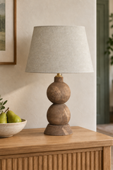 Tapered beige linen shade on the Frampton Medium wooden table lamp