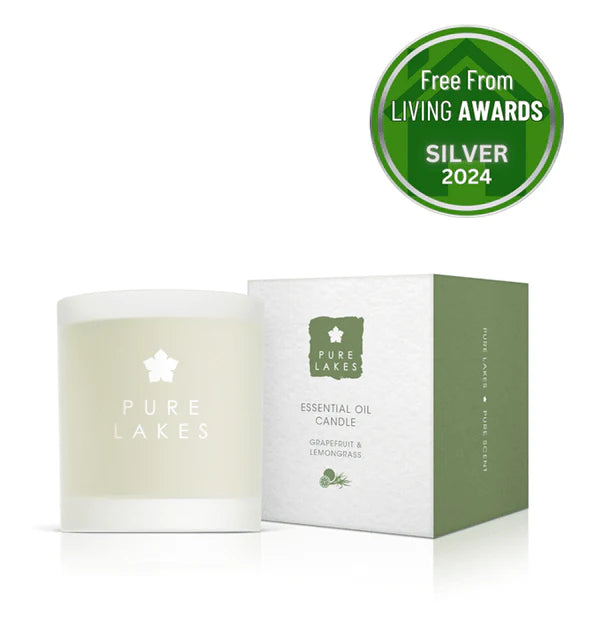 Pure Lakes candle and packaging with a silver award badge on a white background