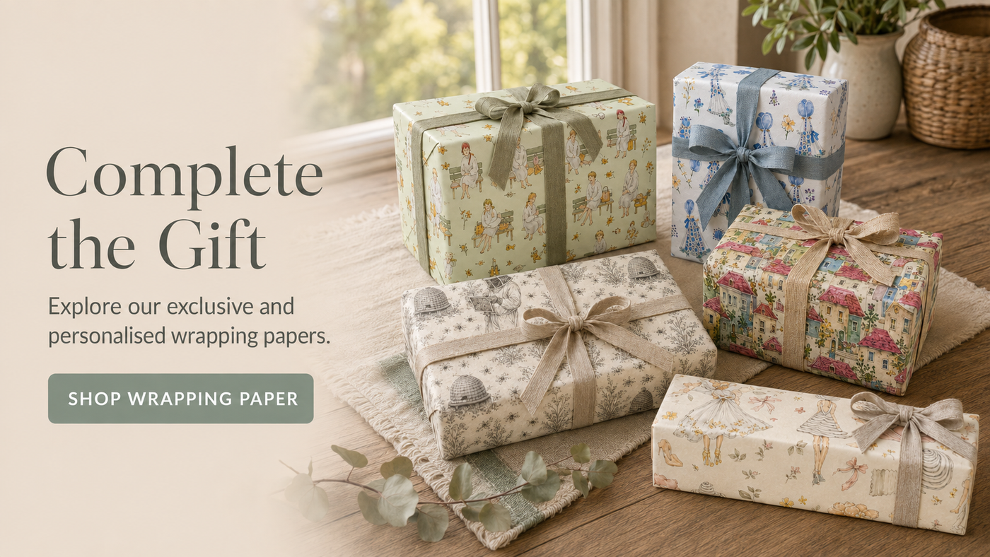 Five gifts wrapped in illustrated Byard’s Boutique wrapping papers with natural ribbons, styled on a rustic wooden table.