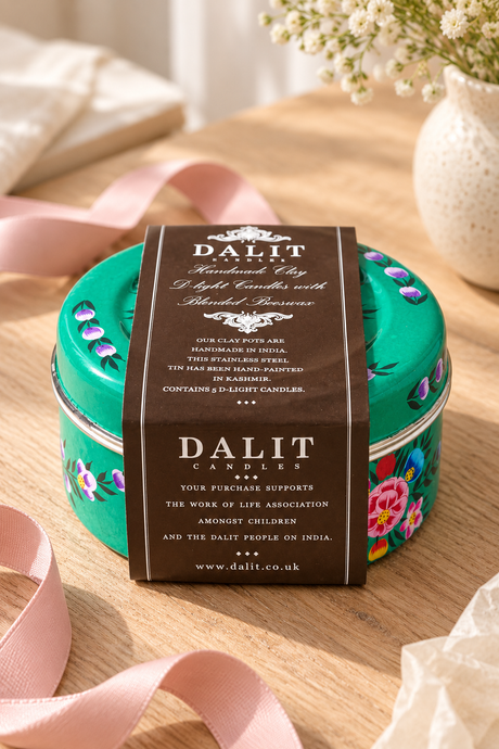 Gift set containing five hand-poured beeswax-blend candles in handmade terracotta pots and one reusable green stainless steel tin. The tin is hand-painted in Kashmir with multicoloured floral decoration. Candles are handmade in India and scented with lavender and a subtle hint of vanilla.