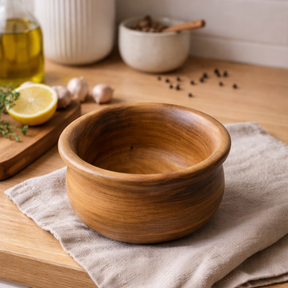 Wooden bowl on a wooden surface with a neutral background