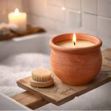 terracotta candle in bathroom on wooden board