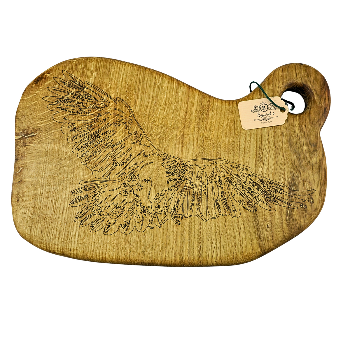 Wooden cutting board with engraved eagle wings and a tag on a white background