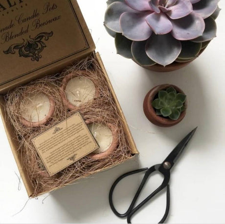 Murgan handmade terracotta candle set containing four clay pot candles