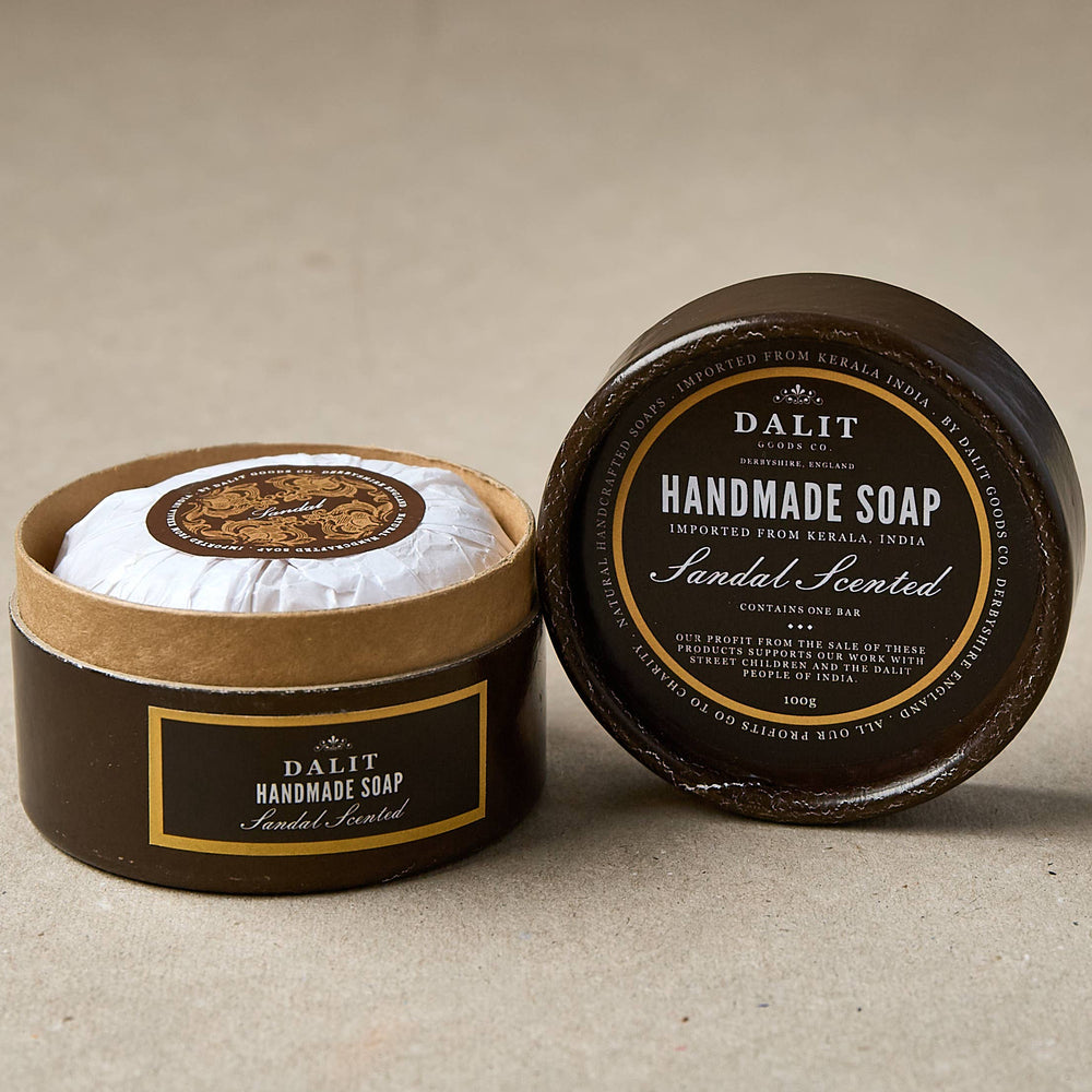 Handmade soap in a round container sandal scent with 'Dalit' branding on a beige background