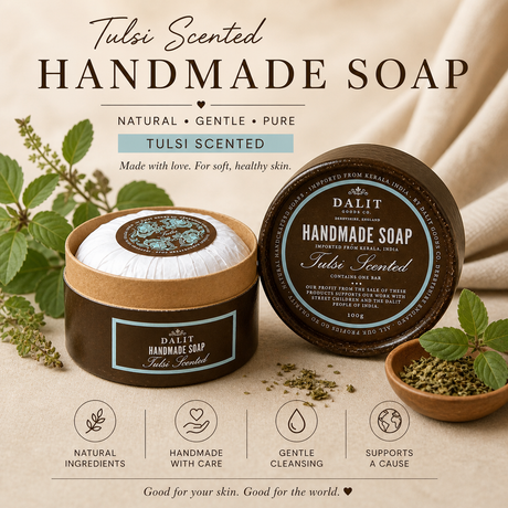 Handmade soap with tulsi scent, shown in a container and on a surface with tulsi leaves.