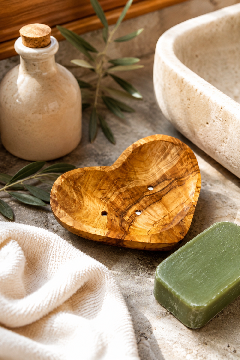 Heart-shaped olive wood soap dish with drainage holes