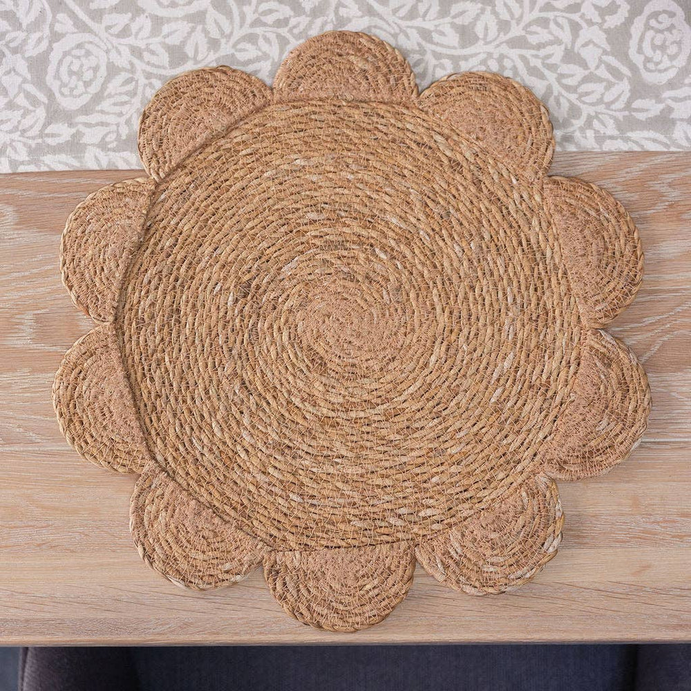 large natural handwoven seagrass placemats with round scalloped edges, each approximately 40cm in diameter.