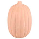 terracotta pumpkin-shaped decoration on a white background