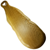 “Large handmade oak charcuterie board with a natural waney edge and detailed wooden handle.”