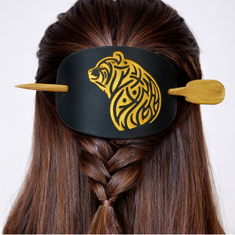 Black hair tie with gold bear design worn in various hairstyles on a white background