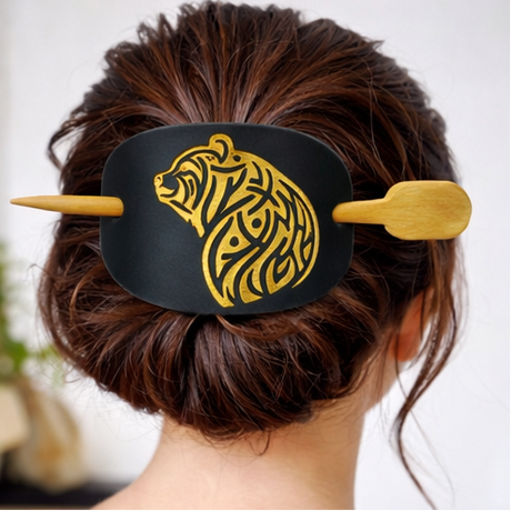 Black hair tie with gold bear design worn in various hairstyles on a white background