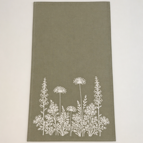 Linen Sage Green towel with white floral pattern on a light beige background